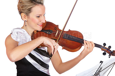 Buy stock photo A lovely young woman wearing an evening dress playing violin