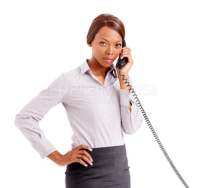 Buy stock photo An upset business woman with her hands on her hip talking on the phone