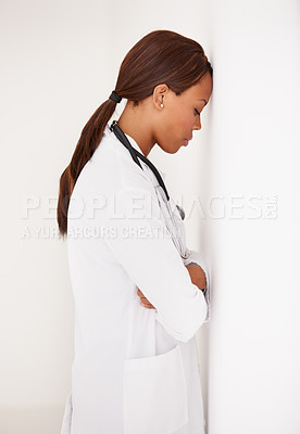 Buy stock photo Tired black woman, doctor and stress in fatigue, burnout or healthcare from mistake at hospital. Face of exhausted African female person, surgeon or medical nurse asleep or leaning on wall at clinic