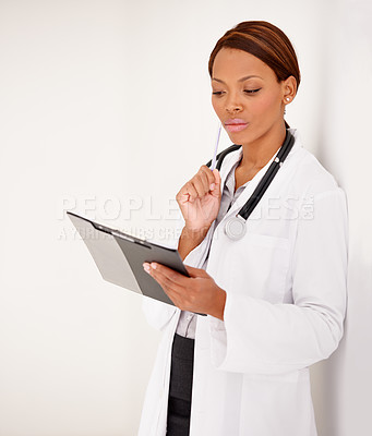 Buy stock photo Woman, doctor thinking and medical charts for hospital schedule, management or results with solution or idea. African person reading of healthcare checklist, clipboard or folder on a wall background