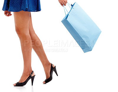 Buy stock photo Woman, legs and shopping bag in high heels for fashion isolated against a white studio background. Female person, shopper or model walking with gift, present or sale discount on clothing purchase