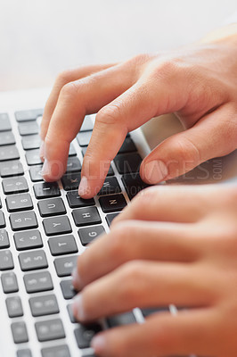 Buy stock photo Cropped shot of a businessman's hands on a laptop keyboard