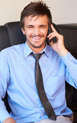 Buy stock photo Cropped shot of an attractive businessman on the phone