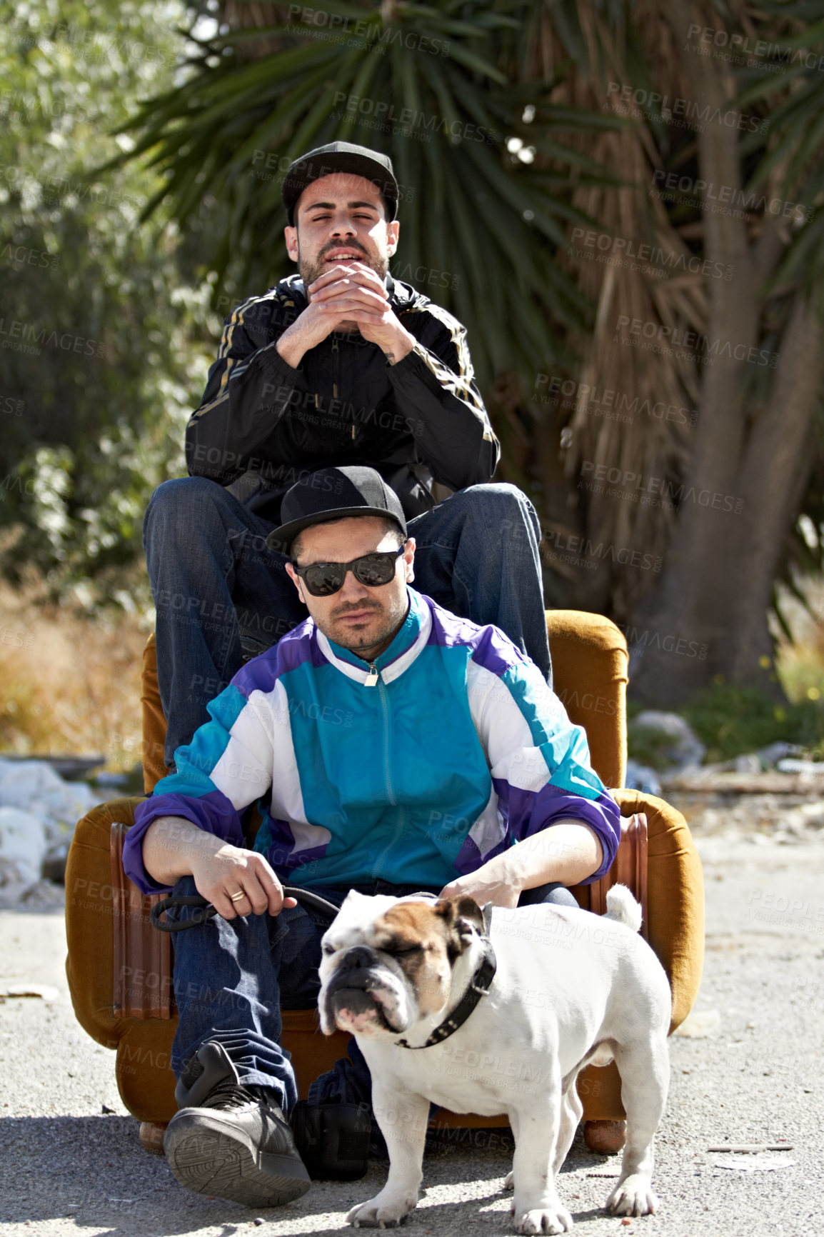 Buy stock photo Portrait, retro style and dog with friends and their pet outdoor in a downtown neighborhood together. Street, fashion and culture with men and their bulldog puppy on an urban background