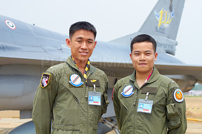 Buy stock photo A shot of two confident asian fighter pilots