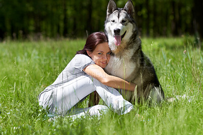 Buy stock photo Woman, husky and smile in portrait, field or park with hug, love and bonding with care in summer sunshine. Girl, pet dog and happy in nature, woods or grass with embrace on adventure in countryside