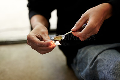 Buy stock photo cropped closeup of a person heating narcotics in a teaspoon