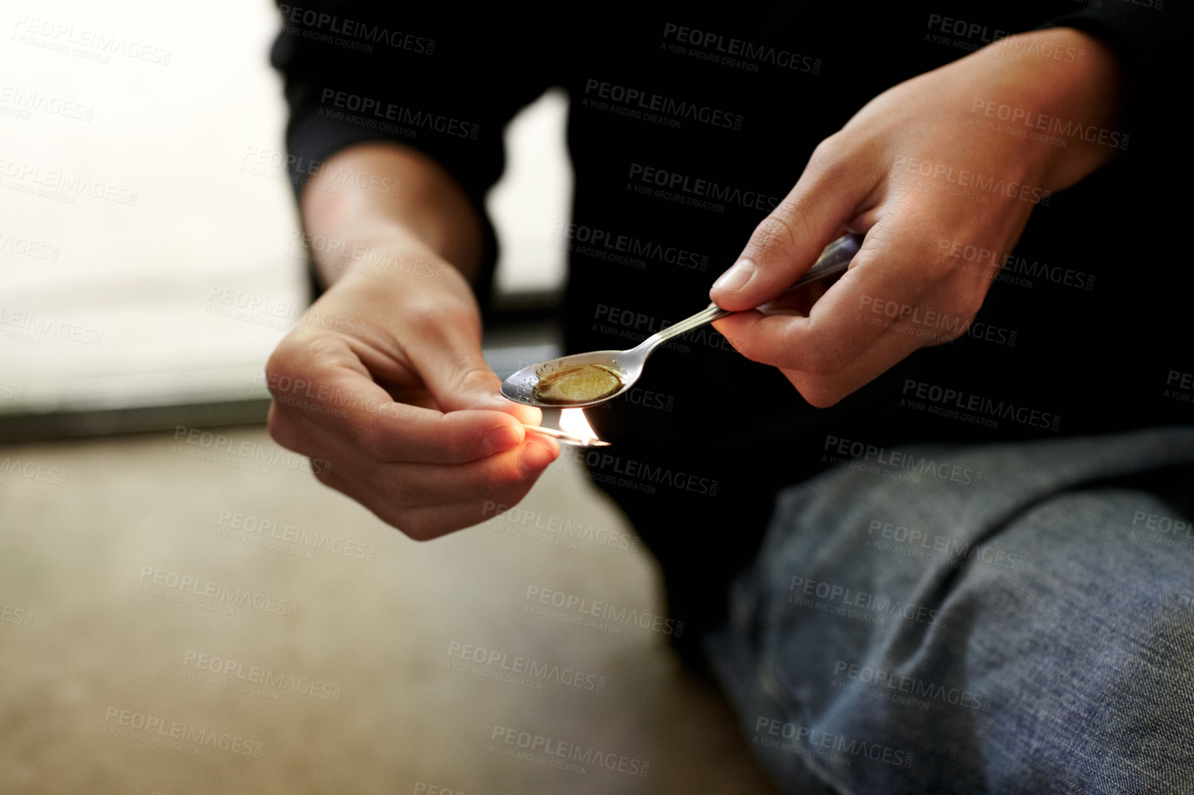 Buy stock photo cropped closeup of a person heating narcotics in a teaspoon