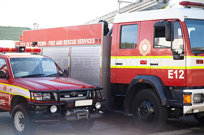 Buy stock photo Fire engine, truck and rescue services at station ready for firefighting, emergency and transportation. Firefighter vehicles parked outside for safety, transport and equipment  for brigade protection