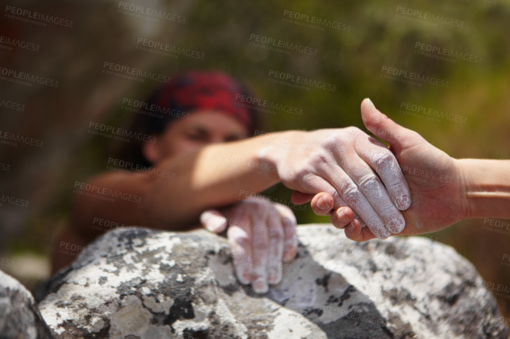 Buy stock photo Hands, help and grip with a rock climber on a mountain from above for freedom, adventure or adrenaline. Fitness, teamwork and assistance with a person climbing a cliff for exercise or recreation