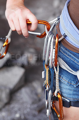 Buy stock photo Woman, carabiner and rock climbing for adventure safety or outdoor cliff for extreme sport, hill explore or gear. Female person, rope equipment for mountain trekking or hook,  challenge for workout