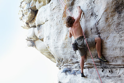 Buy stock photo Man, rock climbing and mountain rope adventure or sports challenge, risk performance on stone crack. Male person, hanging and outdoor cardio gear or courage as fearless athlete, brave danger on cliff