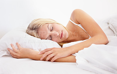 Buy stock photo A beautiful young woman fast asleep in her bed