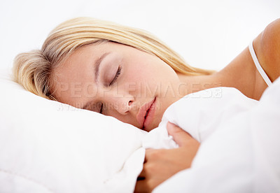 Buy stock photo Woman, eyes closed and sleeping on bed in home for good sleep, relaxed or dream in closeup. Girl, hairstyle and face with peaceful, calm or expression with pyjamas on mattress for comfort on weekend