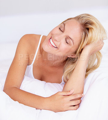 Buy stock photo Happy woman, smile and eyes closed for relaxing in bedroom for quiet, peaceful and calmness. Female person, cheerful or joyful expression on face for resting, zen or comfort alone in home with pillow