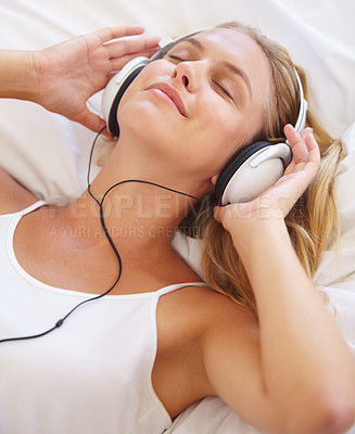 Buy stock photo Happy woman, eyes closed and headphones for music on bed for relaxing. Closeup, female person and peaceful expression on face for listening, audio and streaming service for podcast, radio or song