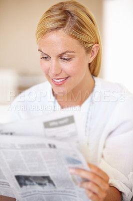 Buy stock photo Woman, smile and newspaper for reading in home for knowledge, information and world news. Female person, happy and face for article, headline and story in publication for daily, update and review