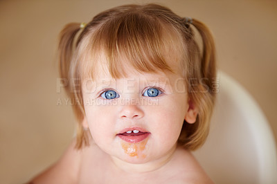 Buy stock photo Portrait, eating and a girl baby with food on her face closeup in the home for growth or child development. Kids, breakfast and adorable little infant in a feeding chair for health, diet or nutrition
