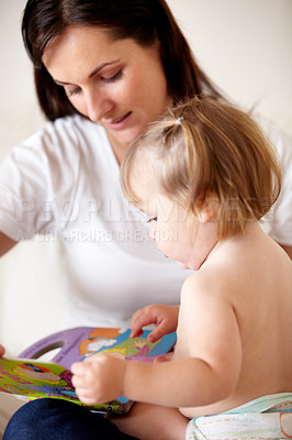 Buy stock photo Baby, mother and book or reading on sofa with learning, relax and parenting in living room of home. Family, woman and girl child with support on couch in lounge for development, love or education