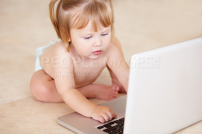 Buy stock photo Growth, learning and a baby typing on a laptop on the floor of a living room in her home for child development. Kids, computer and internet with an adorable infant girl alone in her apartment 
