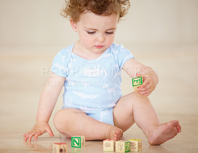 Buy stock photo Full length shot of a cute baby boy playing with toy blocks