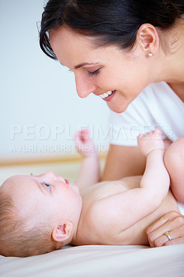 Buy stock photo Face, family or smile with a mother and baby closeup on a bed in their home together for bonding. Growth, love or happy with a young woman parent and infant child in the bedroom of an apartment