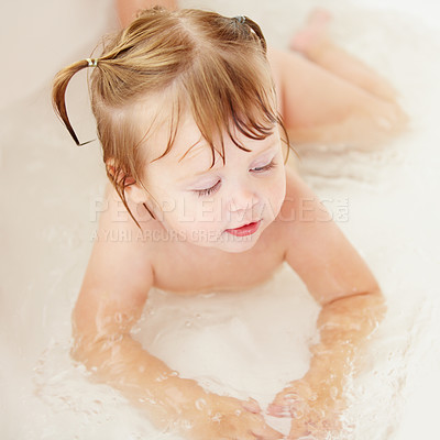 Buy stock photo Children, cleaning and water with a baby in the bath for natural skincare, development or hygiene. Kids, bathroom and a happy young toddler girl in a bathtub for health and wellness in her home