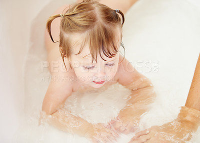 Buy stock photo Kids, cleaning and water with a baby in the bathroom for childhood hygiene or natural skincare. Children, bath and a happy young toddler girl in a bathtub for health and wellness in her home