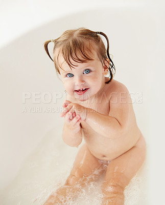Buy stock photo Portrait, cleaning and water with a baby girl in the bath for childhood hygiene or natural skincare. Children, bathroom and a happy young toddler in a bathtub for health and wellness in her home