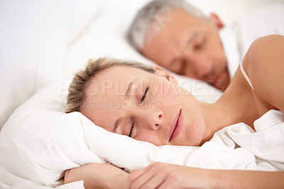 Buy stock photo Relax, bed and a mature couple sleeping for fatigue, rest and dreaming together. Peace, house and a tired man and woman enjoying a nap, bedroom sleep or resting at night during retirement relaxation