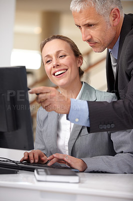 Buy stock photo A senior executive over-seeing the work of his employees