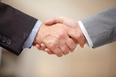 Buy stock photo Close up two businessmen shaking hands