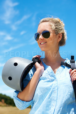 Buy stock photo Shot of a young woman about to go parachuting