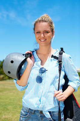 Buy stock photo Woman, parachute and field happy for adventure summer, fearless or outdoor blue skydiving. Female person, smile and portrait or helmet protection for extreme sports or danger, action or jump gear