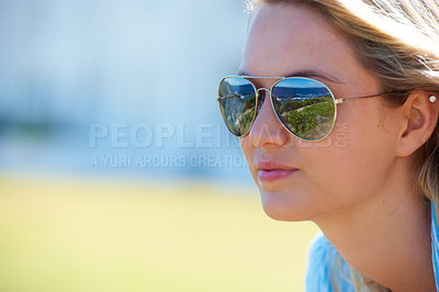 Buy stock photo Cropped shot of a an attractive woman in aviator glasses