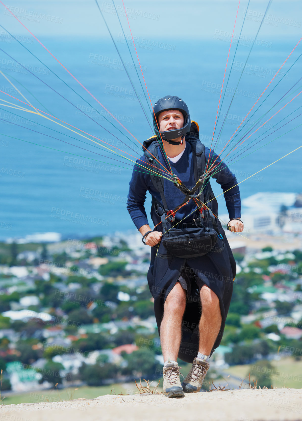 Buy stock photo Shot of a man paragliding on a sunny day