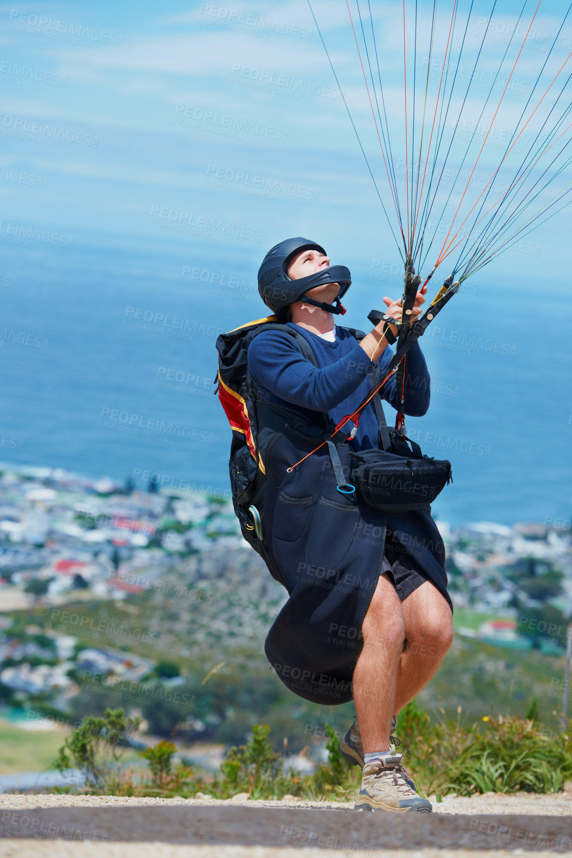 Buy stock photo Man, parachute and paragliding launch in air in nature, healthy adventure and fun in extreme sport. Athlete, take off or fearless for outdoor fitness for wellness, helmet or safety gear by blue sky 