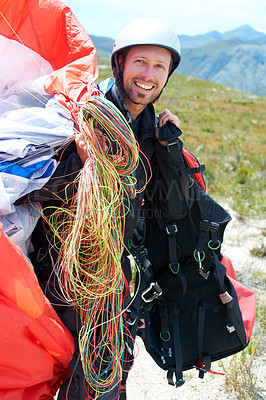 Buy stock photo Paragliding, parachute or man in nature for portrait, happy or strings for training for flight preparation. Athlete, face or smile for fitness for outdoor wellness, helmet or equipment in countryside