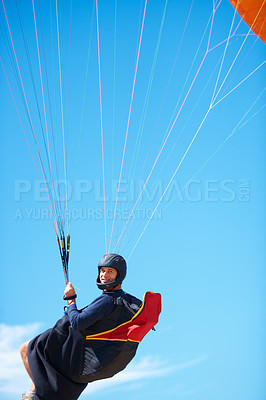 Buy stock photo Man, portrait and paragliding in blue sky parachute for adventure fun, clouds or explore city. Male person, face and outdoor courage for fearless athlete or landing equipment, air safety in nature