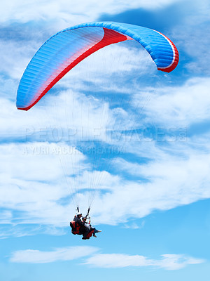 Buy stock photo Man, parachute or paragliding in blue sky for adventure, flight freedom or courage with extreme sport. Pilot, nature and fearless in outdoor fitness for health, sports and wellness with glide in air