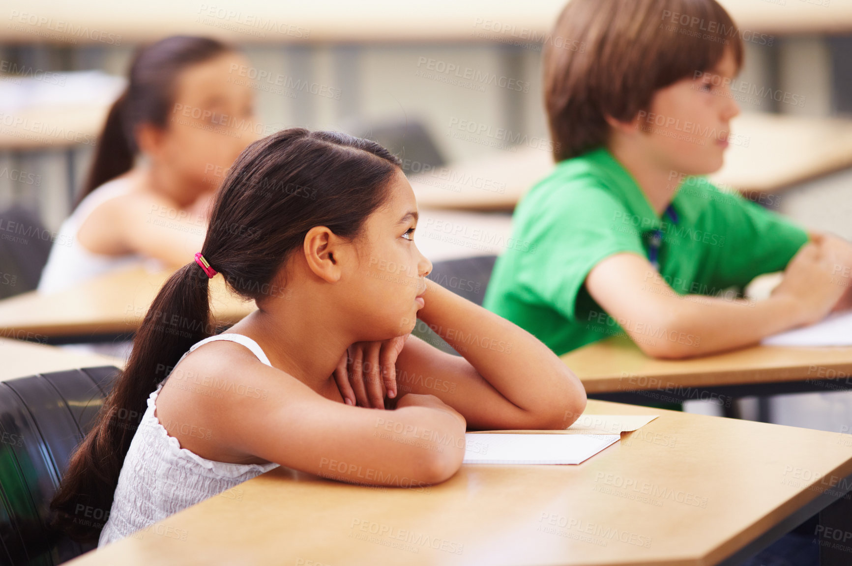 Buy stock photo Scholars sitting in a classroom looking bored