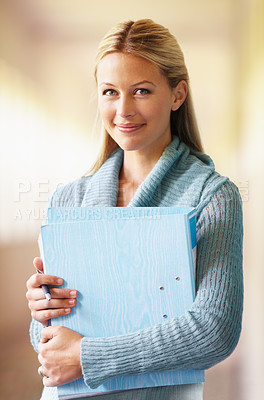 Buy stock photo Portrait, teacher and woman with folder in hallway of school with pride for career or job. Education, binder and serious female educator in corridor ready for teaching, learn or working in Australia.