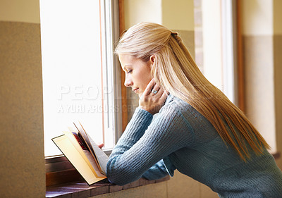 Buy stock photo Woman, young student and reading a book or in school hallway or campus and window for exams. Lady, university learner and knowledge or literature or classroom and project for test for information 