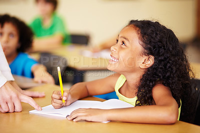 Buy stock photo Teaching, child writing and hand of teacher helping student at school for education, learning or development. Woman with happy girl for notebook, pencil and knowledge at classroom desk with support