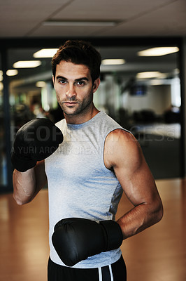 Buy stock photo Man, boxing gloves and workout with gym portrait for health, wellness or training for fight, performance or sport. MMA, boxer or strong for contest, competition or exercise for development with sweat