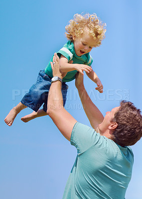 Buy stock photo Happy, lifting and air with father and son for playful, bonding and parenting. Smile, summer and affectionate with man and young boy playing for happiness, trust and free time on weekend