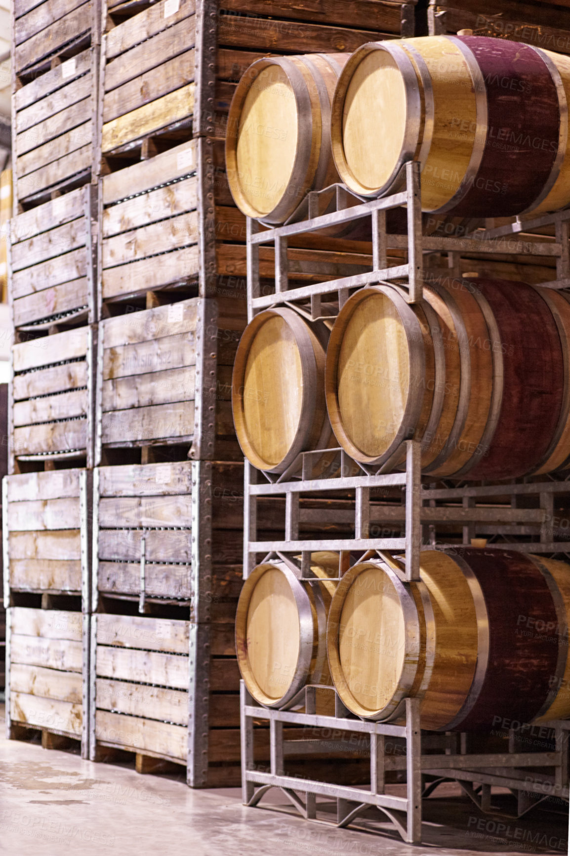 Buy stock photo Wine, storage and oak barrels in a cellar for the production, manufacturing or fermentation of alcohol. Stock, wood container and industry with beverage produce in a warehouse, plant or factory