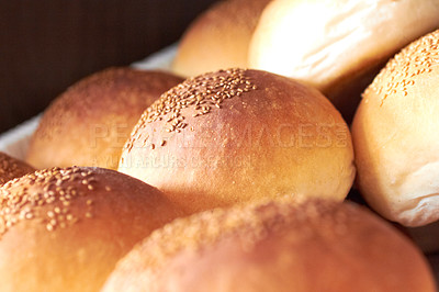 Buy stock photo Sesame bread, food and bakery basket of rolls from cooking, catering service, breakfast or baking meal at cafe. Closeup of fresh baked, buns or roll snack for eating, nutrition or fiber in restaurant