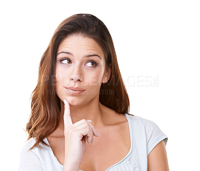 Buy stock photo A lovely young brunette looking away thoughtfully while isolated on white