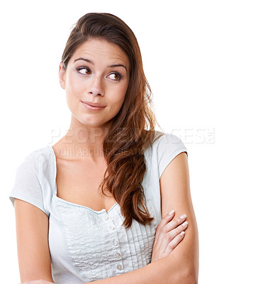 Buy stock photo A beautiful young woman looking to the side with her arms folded
